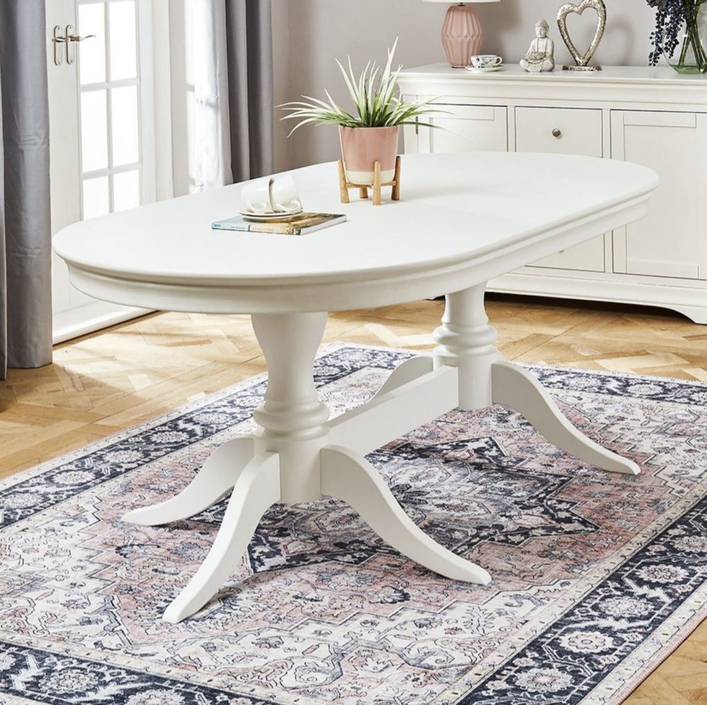 Wilmslow white painted oval dining table with twin pedestal base