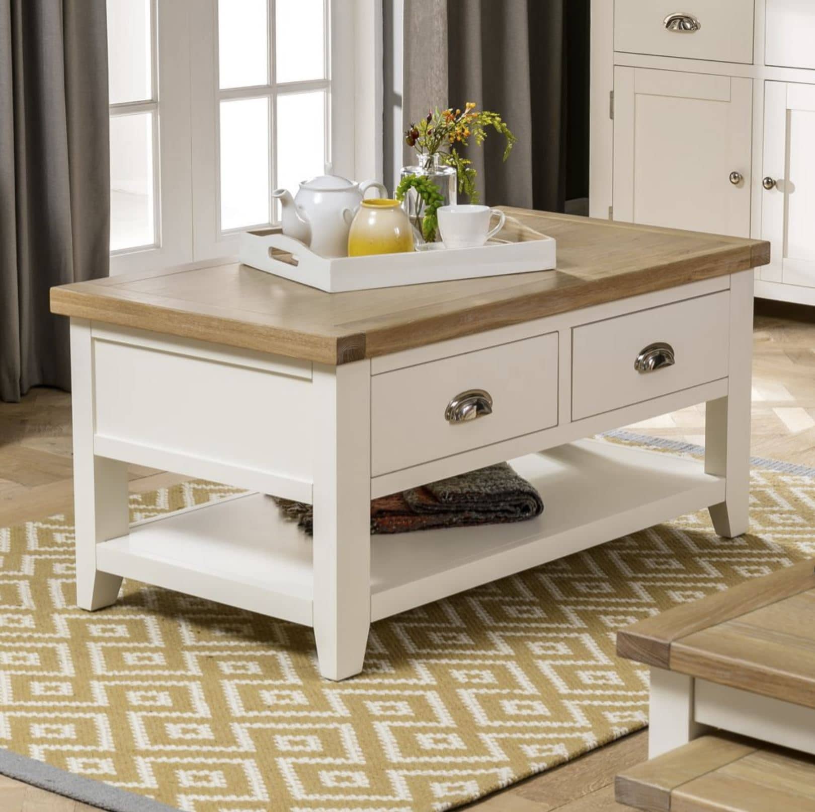 Cosy Nights In with our Cheshire Cream Painted 2 Drawer Coffee Table with Shelf