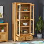 Soho Oak Glazed 2 Door 2 Drawer Tall Display Cabinet Unit